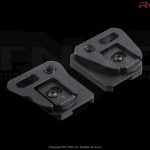 Two metal plates for mounting gear accessories.