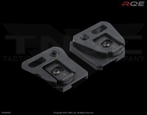 Two metal plates for mounting gear accessories.