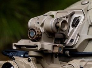 Tan SWIFT helmet mount with optic on rail.